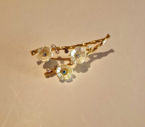 flower twig brooch on cream background