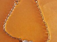 heart gold bracelet with white enamel detail