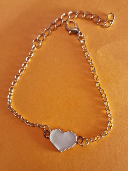 heart gold bracelet with white enamel detail