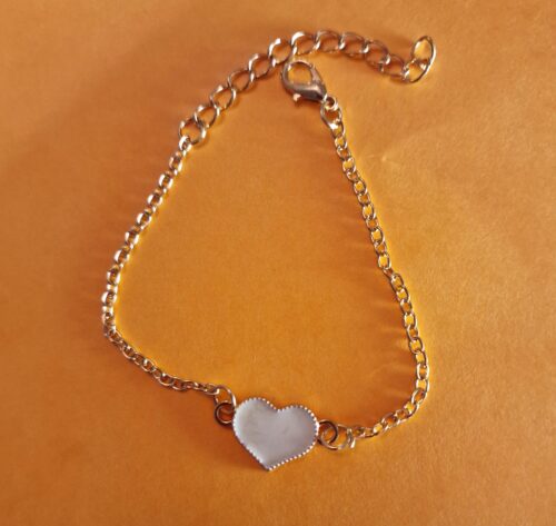 heart gold bracelet with white enamel detail