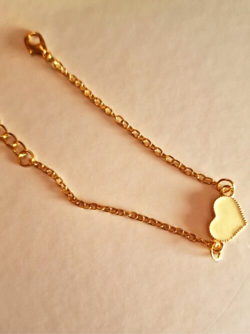 heart gold bracelet with white enamel detail