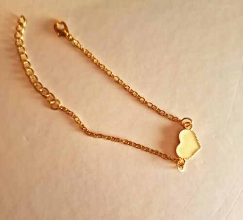 heart gold bracelet with white enamel detail