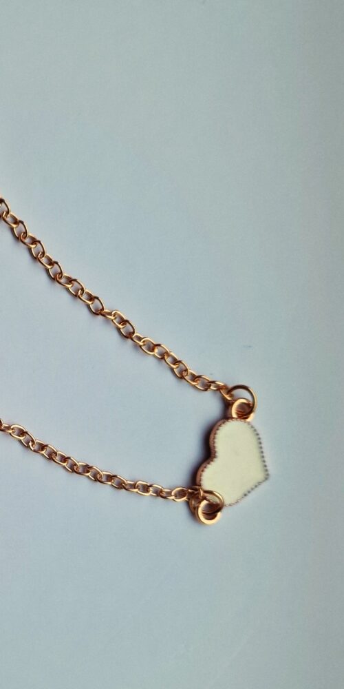 heart gold bracelet with white enamel detail