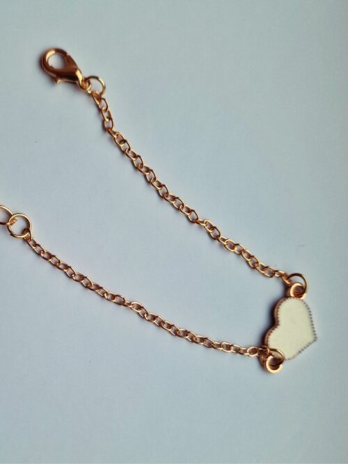 heart gold bracelet with white enamel detail