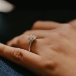 a ladies hand with a ring on it