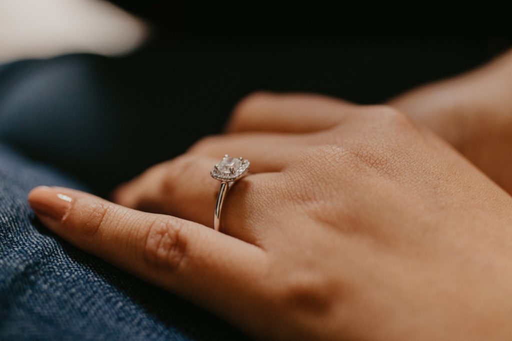 a ladies hand with a ring on it