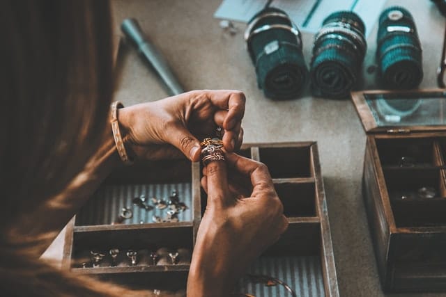 jeweller at the bench working on a ring