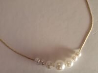 multi pearl necklace on gold plated chain.
