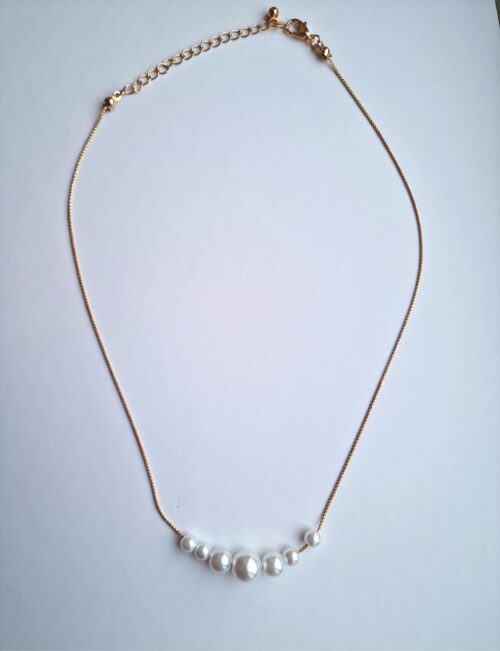 multi pearl necklace on gold plated chain.