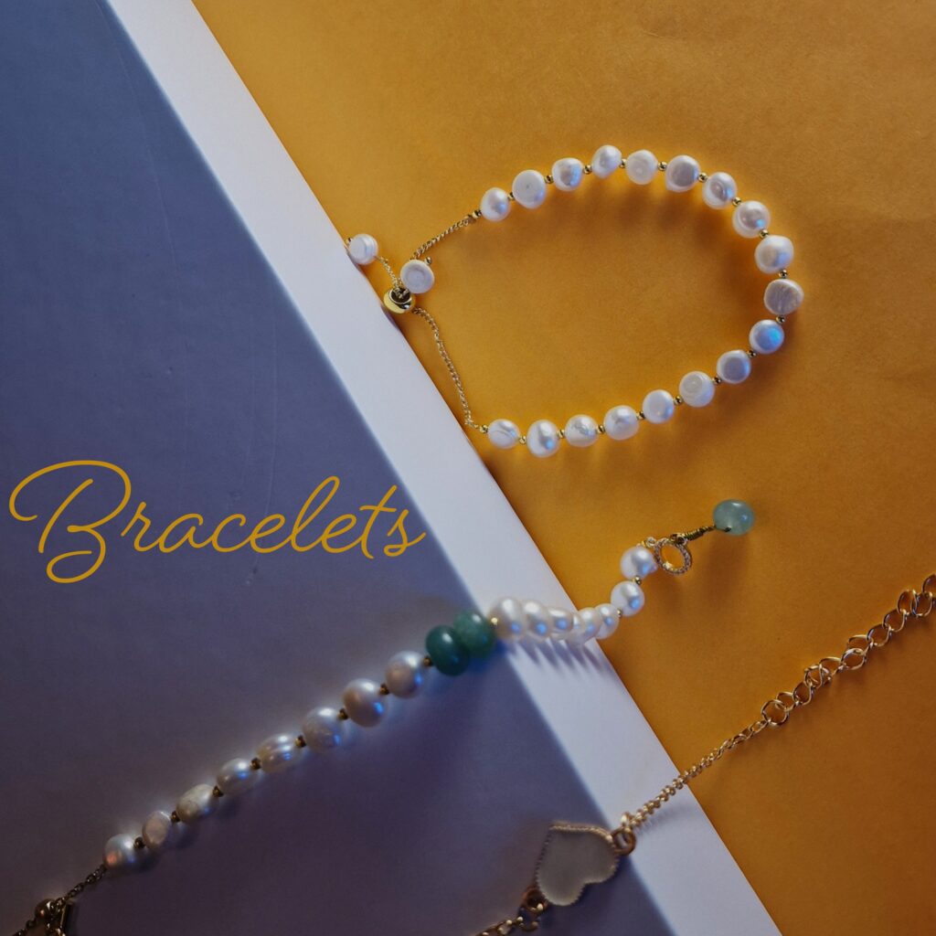 a selection of bracelets displayed with colourful background