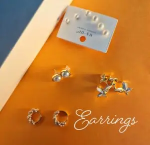 A collection of earrings on coloured card