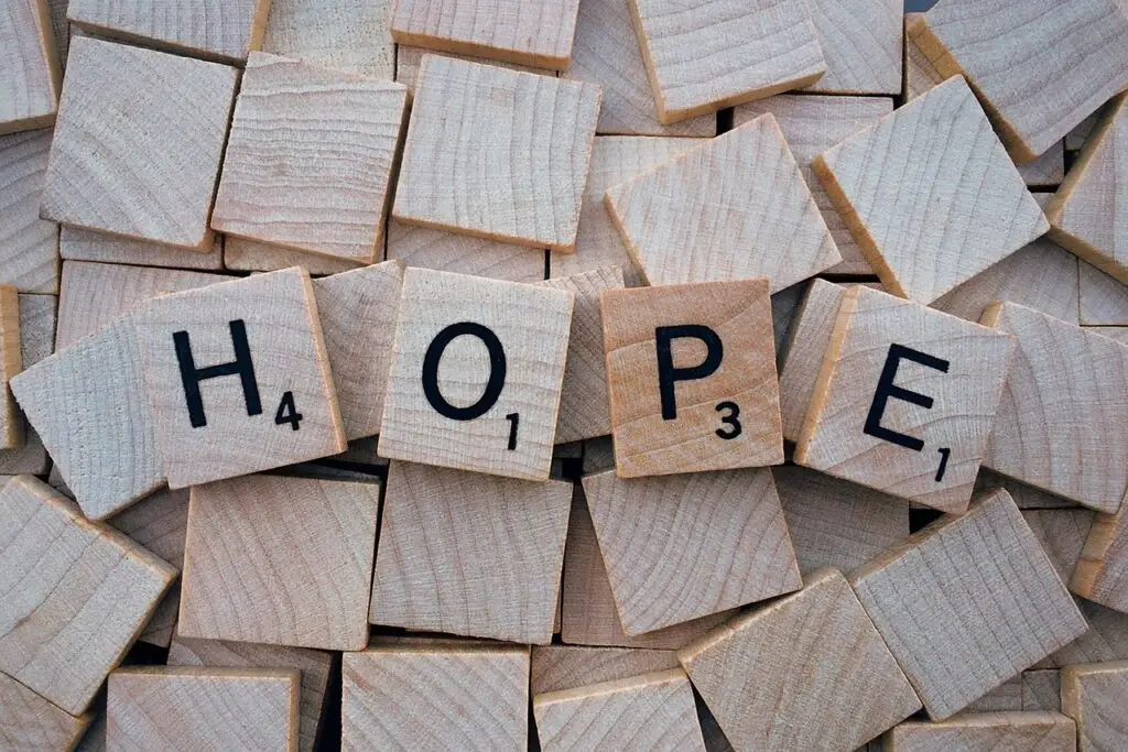 wooden tiles spelling out the word hope.