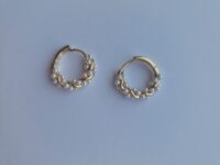 Formosity jewellery presents one of their products from their patience collection twisted gold plated pearl hoop earrings. These cute earrings have small pearl style beads intertwined with gold plated metal in a hoop shape. The earrings are made from stainless steel with plated 9 carat gold with a comfortable clasp fastener. 
