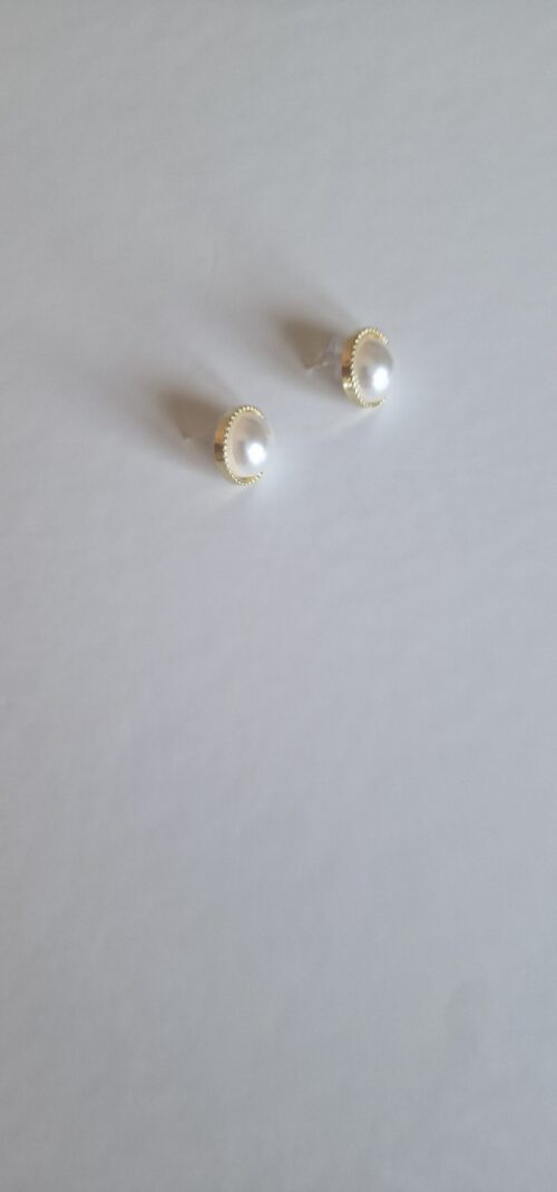 gold plated earrings with pearl on a white background
