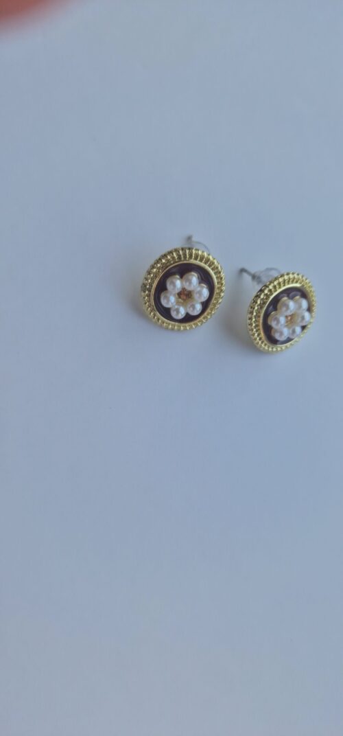 Two flower pearl gold plated earrings with pearl detail on a white background