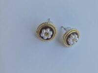 Two flower pearl gold plated earrings with pearl detail on a white background