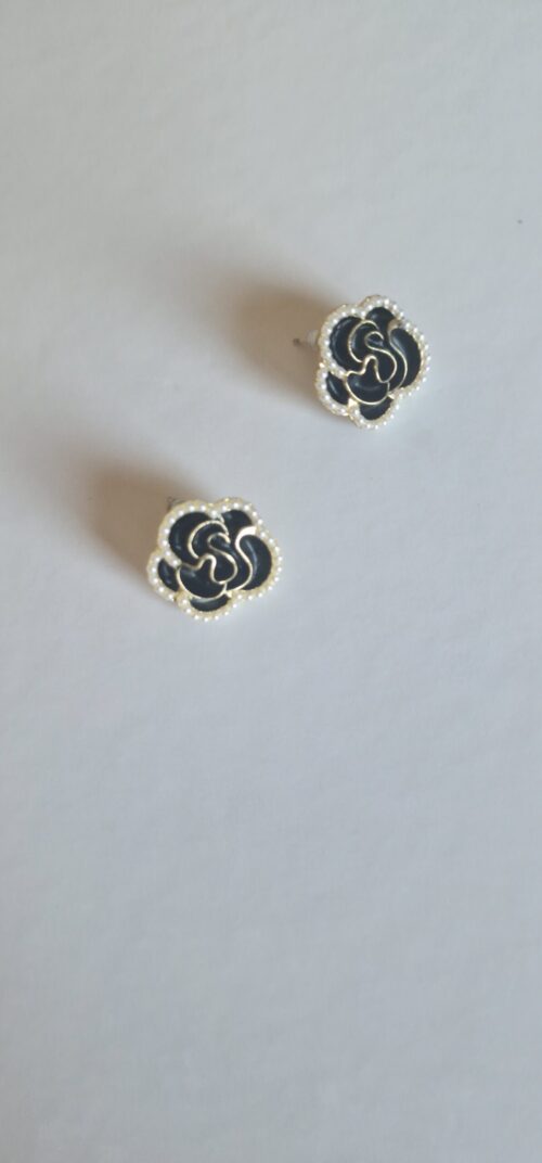 Black burgundy gold rose earrings with pearl detail on a white background.