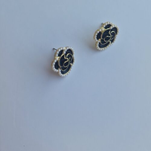 Black burgundy gold rose earrings with pearl detail on a white background.