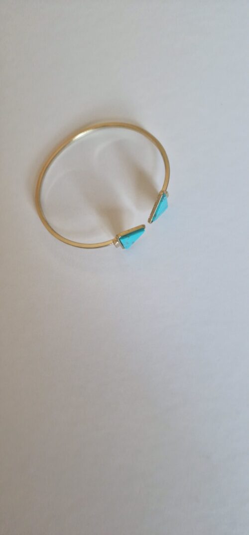 Marble Gold bracelet on a orange background.