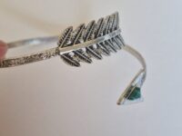Silver Feather and Arrow Armband (Don Bell) on a white background.